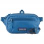 This is a picture of a blue Patagonia hip pack, on top of a white background.