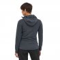 Woman stood backwards wearing the Patagonia recycled fabric hooded autumn jumper on a white background