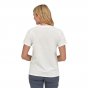 Woman stood backwards wearing the Patagonia 100% organic cotton white logo tee on a white background
