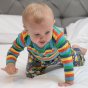 baby wearing rainbow striped organic cotton long-sleeve babysuit from piccalilly