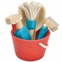 Plan Toys Cleaning Role Play Set including wooden squeegee, mop, dustpan, cleaning spray held within a red bucket. 