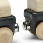 Close up of the Plan Toys wooden toy train set showing the magnetic couplings on a white background
