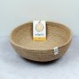ReSpiin Jute Natural Medium woven Bowl with on a grey surface with product label inside bowl