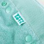 Close up of the velcro and popper adjusters on the Totsbots eco-friendly moss green bamboozle high absorbency baby nappy 