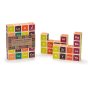 Uncle goose plastic free wooden periodic table blocks in a pile on a white background next to their box