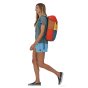 Woman walking on a white background wearing the Patagonia eco-friendly arbor lid backpack in the surfboard yellow colour