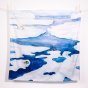 Wonder Cloths frozen arctic organic cotton childrens play fabric hanging from a rope line in front of a white background