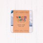 Wonder cloths kids eco-friendly arctic print kids cloth folded up in its paper packaging on a white background