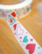 The Babipur Love Heart Paper Tape is a white self-adhesive paper tape with a gorgeous love heart and stars print in red, turquoise and purple.