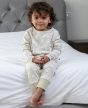 child wearing cotton tail pyjama set from piccalilly