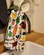 DUNS organic cotton and linen tea towel in the farm life colour, draped over a curved tap 