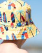 Close up of young child wearing the Frugi organic cotton surfs up harbour hat