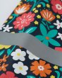 Close up of the reflective strip on the Frugi childrens floral rainy days jacket