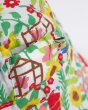Close up of the floral allotment print on the Frugi kids reversible bucket hat