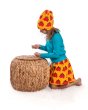 Girl playing with some small pebbles wearing the Maxomorra classic dino print skirt and beanie hat