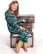 Girl sat on some brown boxes wearing the maxomorra organic cotton classic lp print pyjamas set