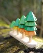Close up of Plan Toys sustainable Sort and Count Tree toy on a wooden log