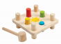 Plan Toys Hammer Peg Wooden Baby Toy, a classic wooden toy hammer bench with colourful pegs for babies and toddlers. White background. 