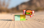 Close up of the Candylab wooden burger shack toy on some sand