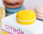 A closeup picture of the large yellow macaron on the roof of the Candylab Candyvan Citron truck.