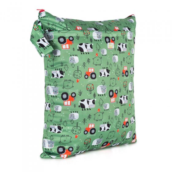 Baba + Boo Reusable Medium Wet Bag in green with a farmyard print of red tractors, cows, chickens, trees and pigs. with a side handle, a zip closure on a white background