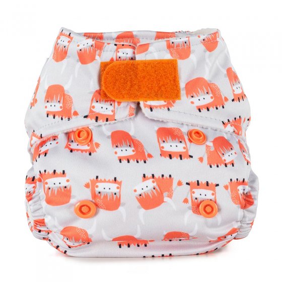 Baba + Boo eco-friendly reusable Newborn Nappy in an off white with an orange fringed highland cow repeat print, orange closure tab, photographer on a white background
