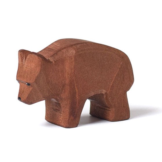 Close up of the Bumbu eco-friendly solid wooden bear cub toy on a white background