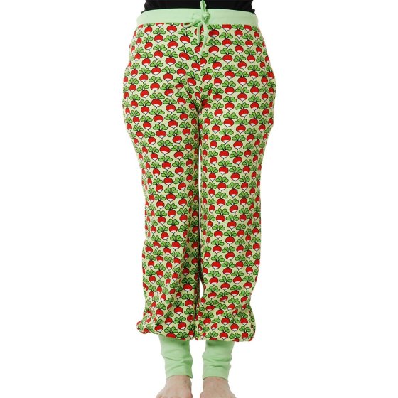 Woman stood on a white background in the DUNS Sweden adults paradise green radish baggy pants
