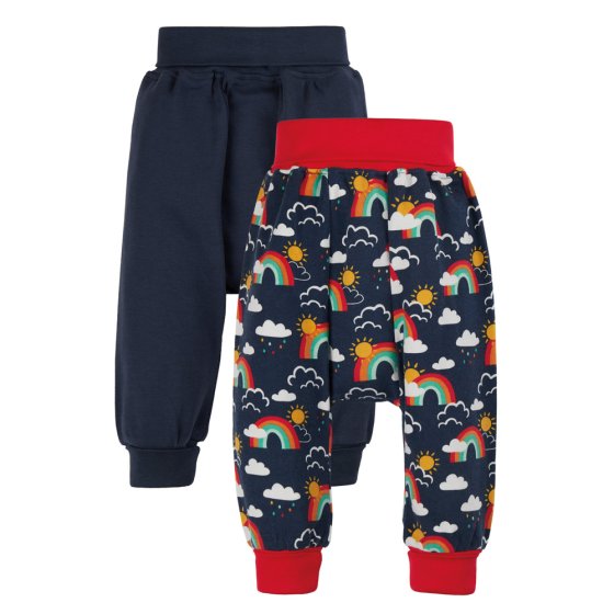 Frugi organic cotton childrens indigo rainbow skies trouser bottoms 2 pack laid out on a white background with the cuffs folded over
