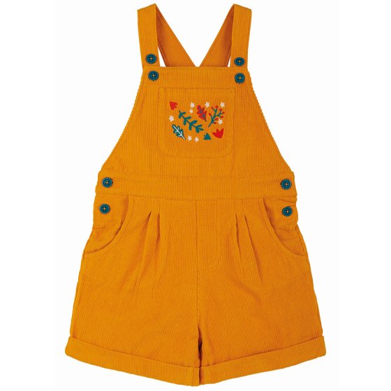 frugi organic cotton gold cord playsuit with blue shoulder & waist buttons, central chest pocket with floral and leaf embroidered detail, hip pockets and turned up shorts on a white background