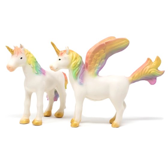 Green rubber toys natural rubber rainbow unicorn and pegasus figures stood on a white background