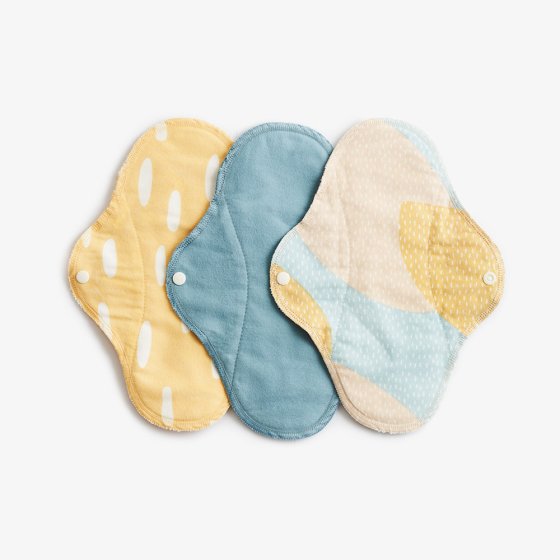 Imse Classic Cloth Pads - regular 3 pack period pads - Blue Sprinkle 3 in blue, yellow and & yellow and blue with white spots & white poppers snaps on a white background