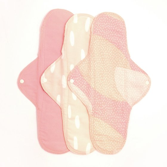 Imse Classic Cloth Pads - night time heavy 3 pack - Pink Sprinkle in light pink with white spots, light pink, beige and neutral tones with white dots and plain pink - all with white popper snaps on a white background