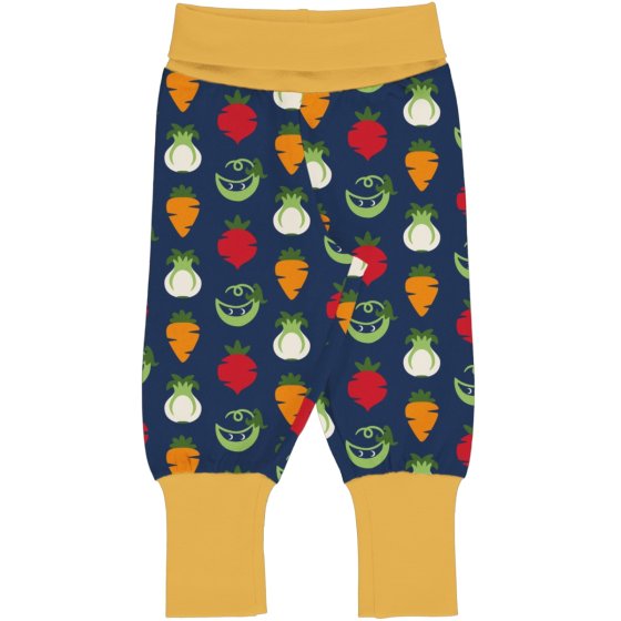 Maxomorra Vegetable Organic Rib Pants. a deep blue base colour with vegetable repeat pattern of carrots, fennel, pea and beetroot. Contrasting yellow cuffs. Pictured on a white background