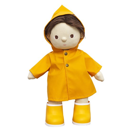 Olli ella dinkum doll toy stood on a white background wearing the yellow rainy play set outfit
