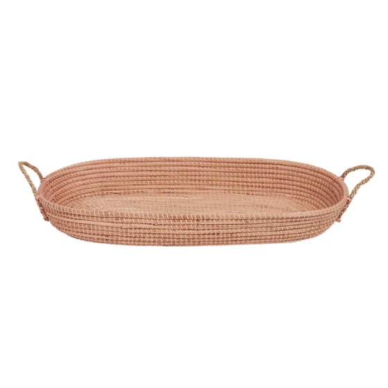 Olli Ella natural seagrass baby changing basket in the rose pink colour on a white background