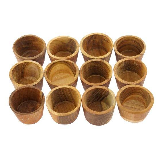 Papoose handmade wooden stacking toy bowls lined up in rows on a white background