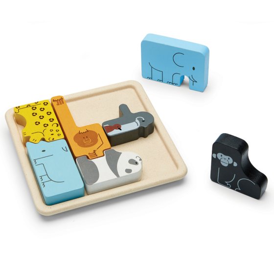 Plan toys eco-friendly wooden animals jigsaw puzzle pieces beside the wooden base board on a white background