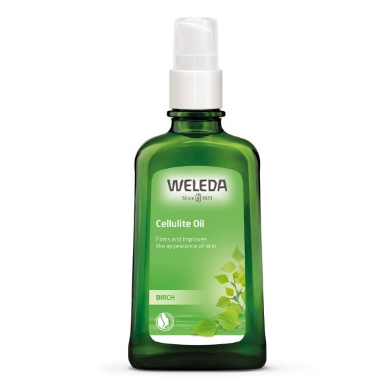 Green bottle of Weleda natural birch cellulite oil on a white background