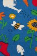 close up garden print of reversible shorts from frugi