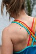 Close up of a womans shoulder wearing the Frugi eco-friendly lyra yoga vest top 