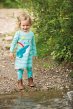 Frugi organic cotton norah whale and rainbow tights worn by a small child near a lake