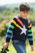 Frugi rainbow storm raglan sleeve stripe jumper with star, and buttons worn by a child outside in the sun