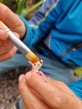 Child using the brush from the Dr Zigs bubble pollinator kit 