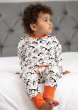 Model wearing Piccalilly Puffin Organic Cotton Pyjamas side view.