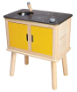 Wooden play kitchen by PlanToys with a sink, twin hob and two cupboards with yellow doors. White background.