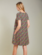 back of a pregnant woman wearing dress with the daisy fields print from frugi