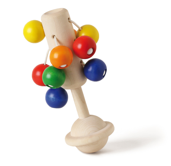 Naef's wooden baby rattle, Dolio, stood up on end on a white background.