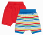 pack of two parsnip style shorts, one has an all over stripy multicoloured rainbow design with a fold down elasticated waistband, the other plain red