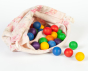 Grapat 36 Wooden Marbles, in six rainbow colours in a fabric storage bag. White background. 
